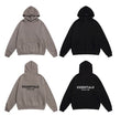 Tan and black fear of god essentials hoodies